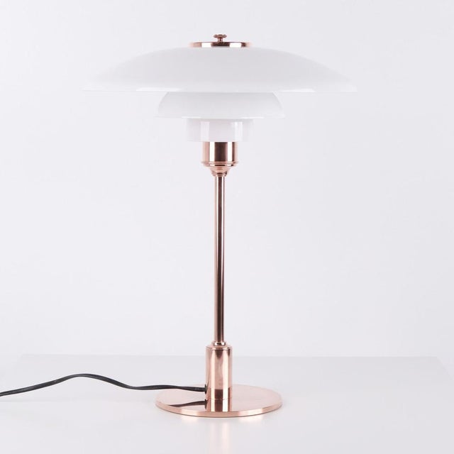 Ph table lamp model ph 3½-2½ limited edition designed by poul henningsen and manufactured by louis poulsen. The lamp is...