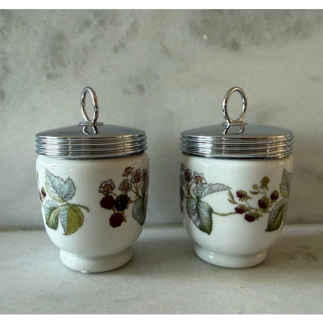 Pair of vintage porcelain egg coddlers made in England by Royal Worcester featuring the classic Lavinia blackberry and...