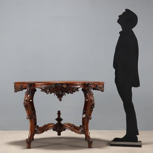 Louis Philippe walnut biscuit coffee table. Top with walnut burl insert supported by four curved legs, joined to a cross-...