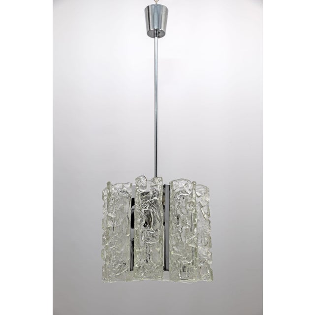 Beautiful Murano glass chandelier, made by Mazzega in the 1970s, the chandelier is composed of sixteen cylindrical...