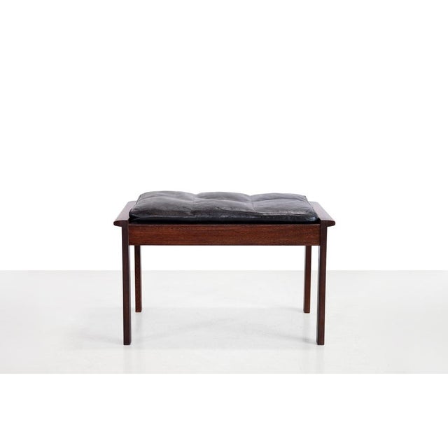 Elegant vintage footstool crafted from solid wenge wood with beautiful artisanal corner joints. The sleek design and rich...