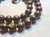 The necklace is 19 inches (48 cm) long, and the smooth round beads are 14mm in size. Boulder opals come from Andamooka,...