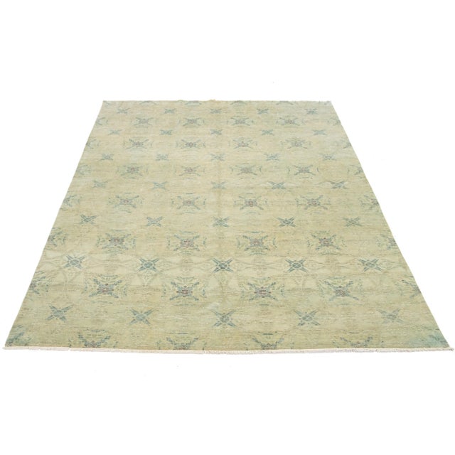 This modern Oushak-style wool rug effectively marries contemporary design with the enduring appeal of traditional Oushak...