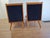 Two armchairs made in Krakow Furniture Factories. Backrest and seats made of navy blue fabric. The armchairs are...