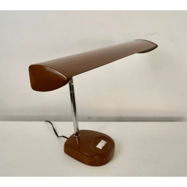 1970's Mid Century Modern table desk lamp for sale. It's in excellent condition, and has a vey cool vintage brown color in...