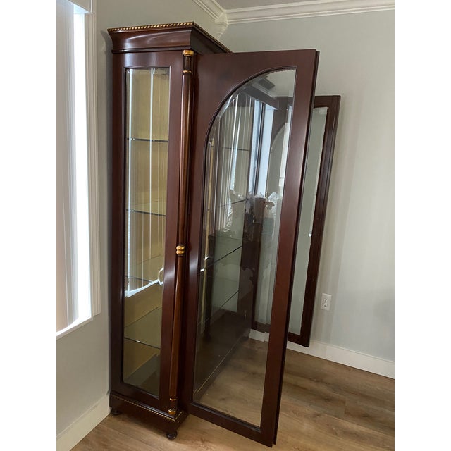 Caspani Tino Italian Display Cabinet in Dark Mahogany with 24K Gold Accents This exquisite Display Cabinet is crafted in...