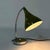 Italian desk lamp from the 1960s. This metal desk lamp with shiny olive green shade, is fully adjustable through the...