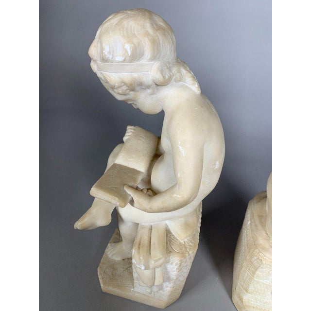 Alabaster Two 19th Century Marble Sculptures: The Child Scribe and The Reader, After Lemire For Sale - Image 8 of 11