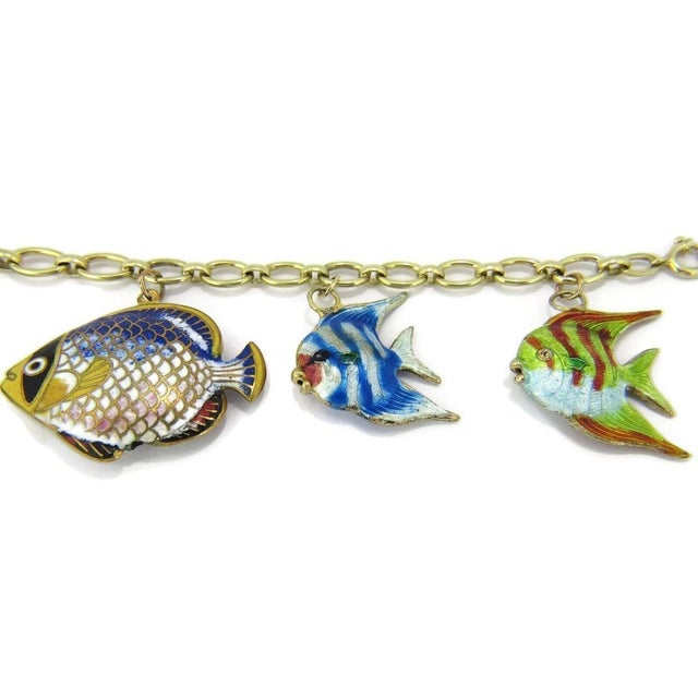 This Multi-Color Enamel 5 Fish 14k Yellow Gold Charms Chain Bracelet is a stunning piece of fine jewelry. The bracelet...
