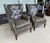 This pair of Hooker Furniture Maya chairs features gently flared wingbacks, button tufting, rolled arms, and nailhead...