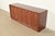An exceptional Mid-Century Modern sculpted walnut sideboard, credenza, or bar cabinet By Broyhill Premier "Emphasis"...