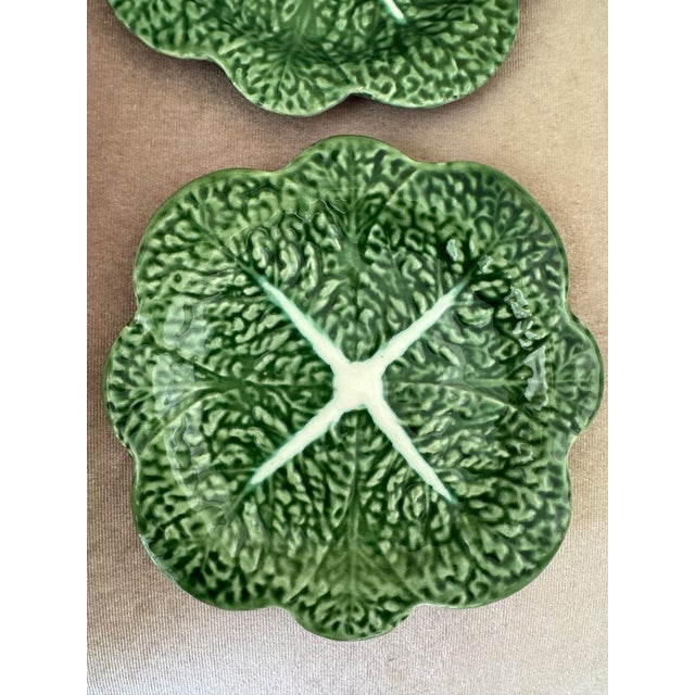 Beautiful vintage majolica-style ceramic plate featuring a realistic cabbage leaf design in rich shades of green with...