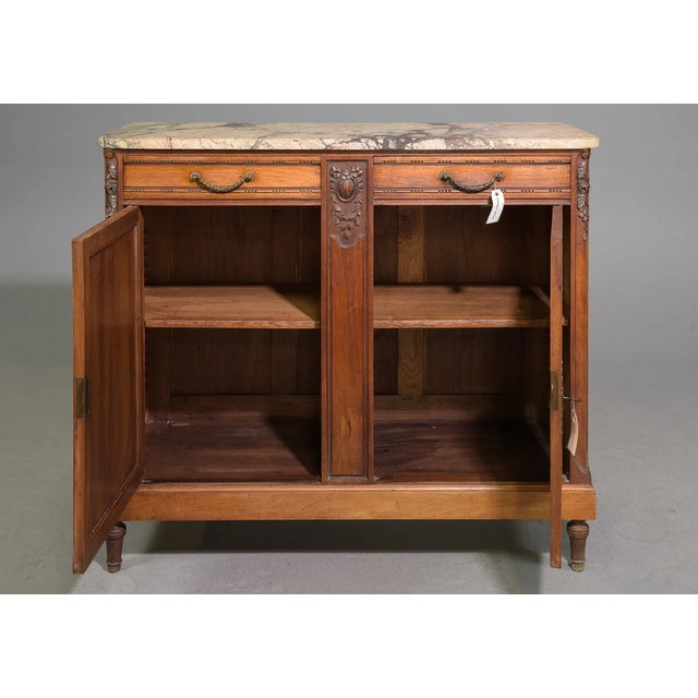An exquisite 19th-century Louis XVI-style buffet, this elegant piece reflects the timeless beauty and symmetry inspired by...