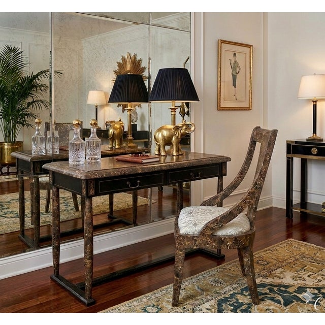 A striking Hollywood Regency writing desk with matching klismos chair, clad throughout in richly figured tessellated...