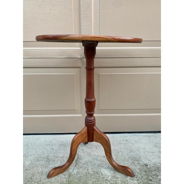 A handsome Georgian-style drinks table crafted in rich solid cherry wood. The elegant turned pedestal and tripod base draw...