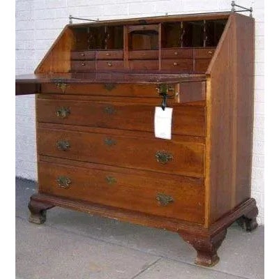 Description: American cherry slant front desk with ogee bracket feet, fitted interior. 1790 Measures 45" by 25" by 47"....
