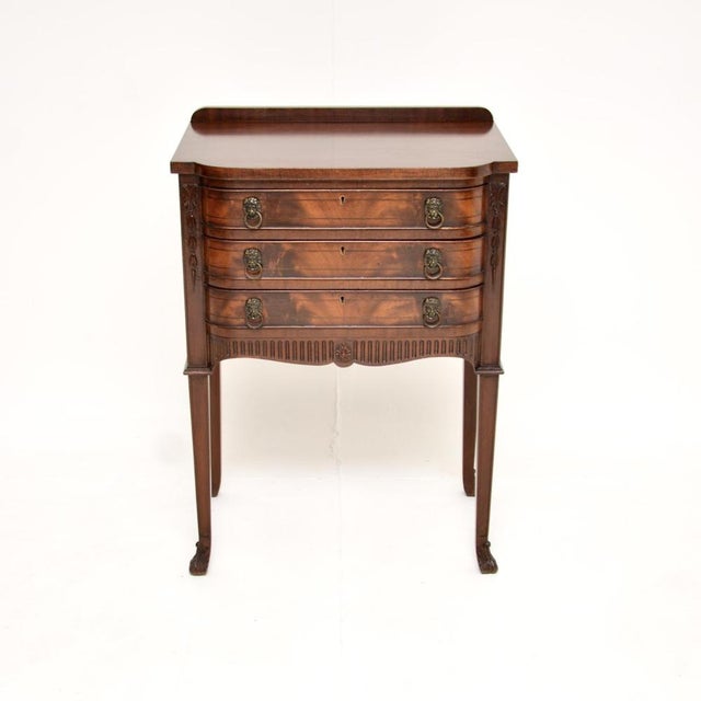 A beautifully designed antique Sheraton style side / server table. This was made in England, it dates from around the...