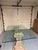 This table is a beautiful statement-making Neoclassical/Hollywood Regency style dining table in excellent condition. The...
