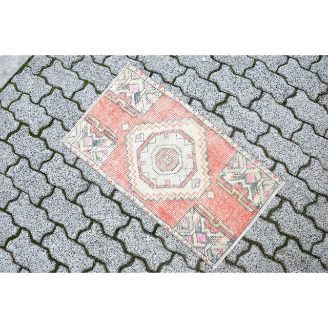 This is a vintage Turkish Oushak rug from the 1960s. The piece was hand-knotted.