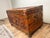 A beautifully hand-carved Chinese Export camphor wood dowry chest, richly decorated with traditional motifs and crafted as...