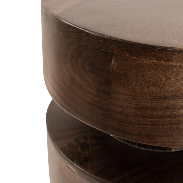 Bold and sculptural, the Forge Tier Accent Table commands attention with its stacked silhouette and rich dark wood finish....