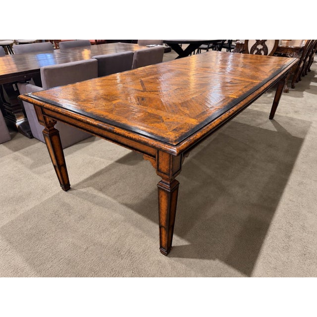 A beautiful blend of rustic character and timeless craftsmanship, this substantial oak dining table features a richly...