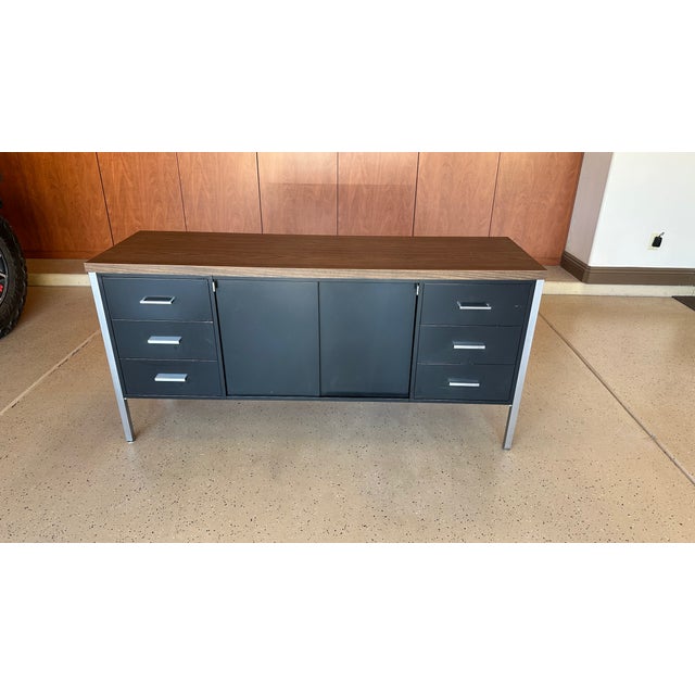Vintage modern black steel / metal tanker credenza with chrome legs and laminate top. Six (6) side drawers with chrome...