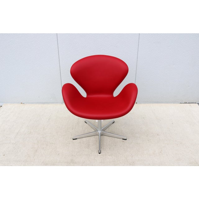 Fabulous mid-century modern new Swan swivel lounge chair in red leather. The beautiful Swan chair is a landmark of mid-...