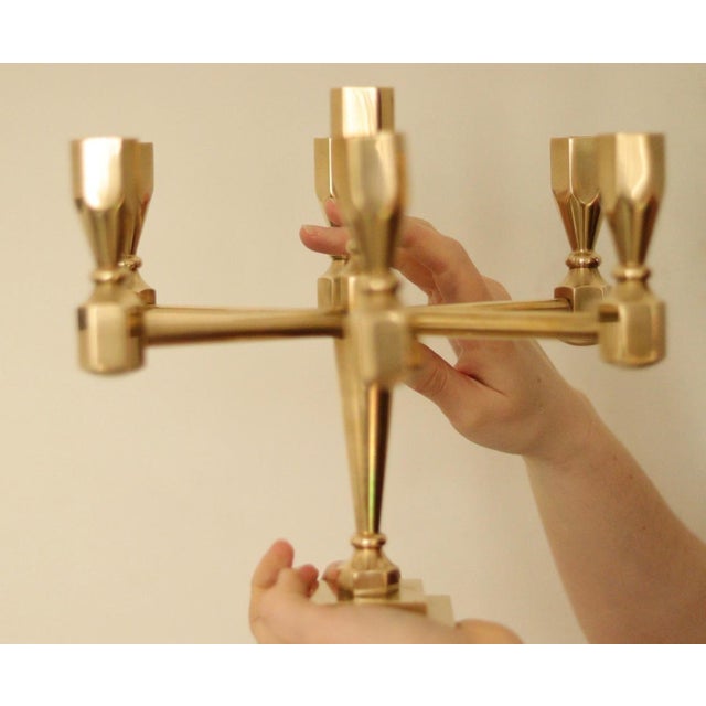 Made in Sweden. A stunning seven-arm solid brass candelabra by gusum from Sweden. This piece is solid, very heavy, and is...