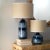 Inspired by Japanese ceramics, this lamp is a stunning ceramic accent that features a deep indigo reactive glaze that...