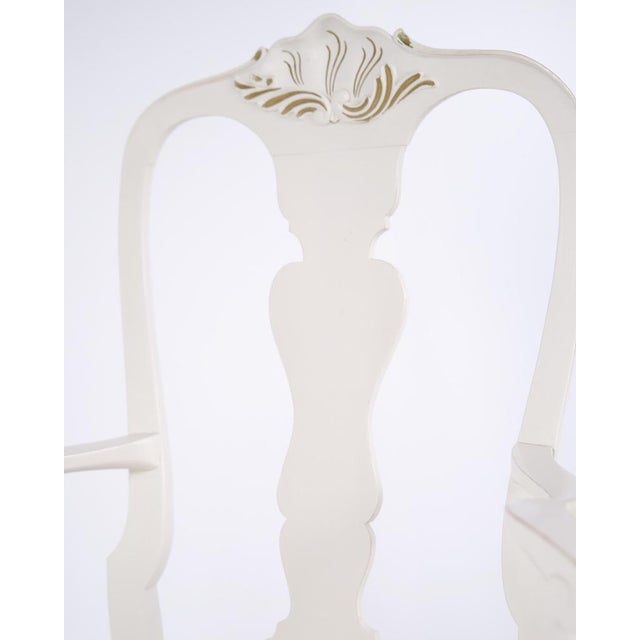 Antique armchairs from the 1920s in neo rococo style. Set of 2 white painted armchairs with decorative details. Antique...