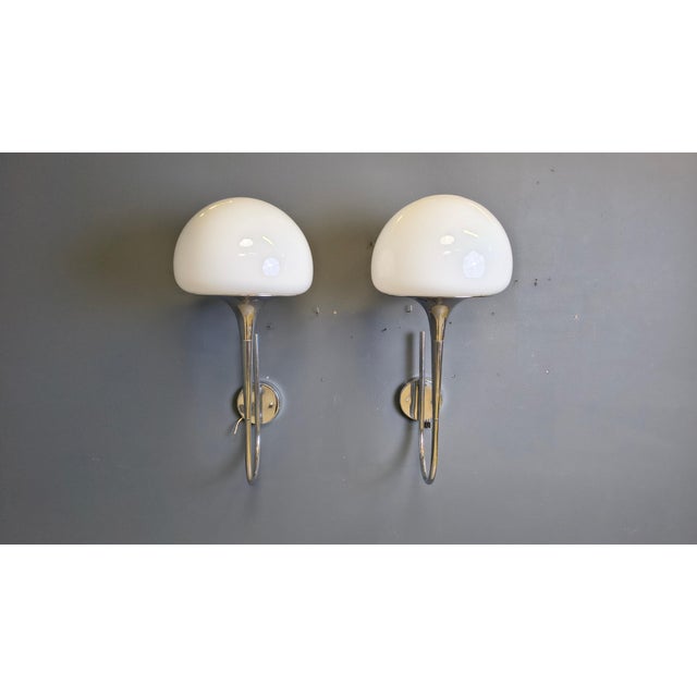 Pair of 'trumpet' shaped wall lights by Goffredo Reggiani with milk glass lamp shades. Beautiful chromed shade holders....