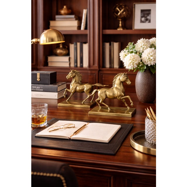 This Vintage Pair of Brass Horses Trotting Figurines are elegant and dynamic pieces from the 1950s, often used as bookends...