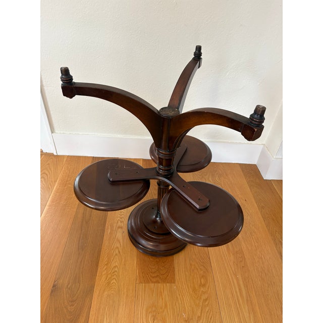 MCM Regency style Mahogany Four Top Plant stand/serving table is both unique and useful. This plant stand has four round...