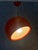 A striking orange pallade pendant lamp designed by studio tetrarch for the italian lighting company artemide in the 1960s....