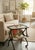 This mid-century Italian service cart and magazine rack was designed by Cesare Lacca in the 1950s and features a dark wood...