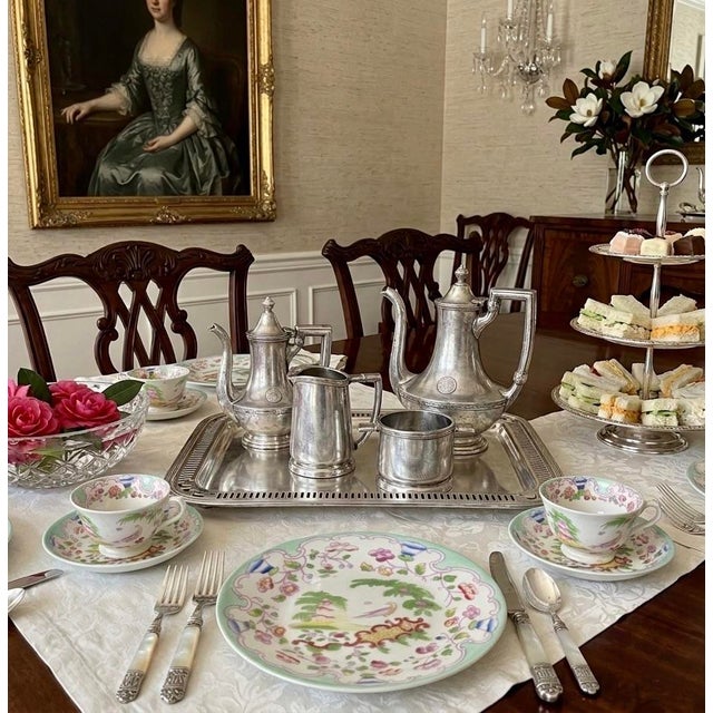 A beautifully married and preserved piece of American hospitality history, this 5‑piece Hotel Silver (silver‑soldered) tea...