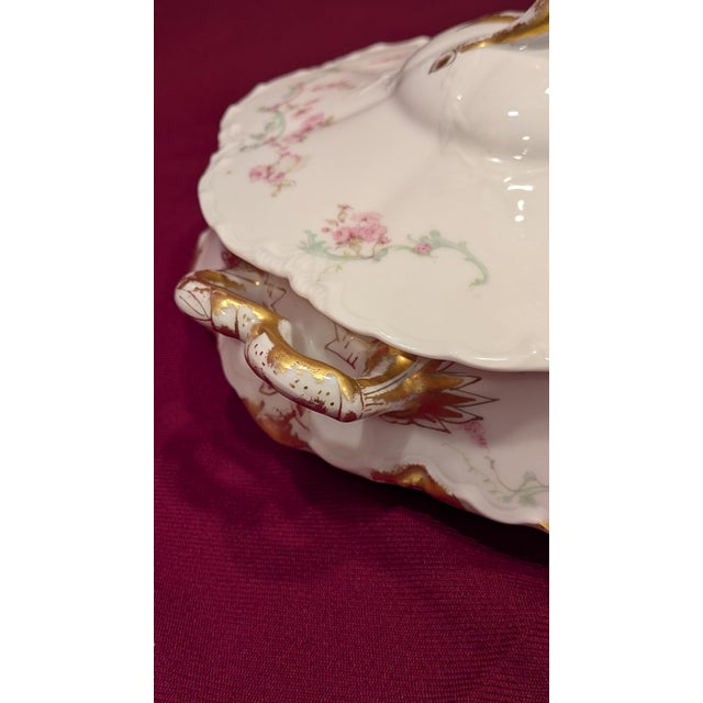 French porcelain covered serving dish produced by Haviland & Co. in Limoges, France, featuring a delicate pink floral...