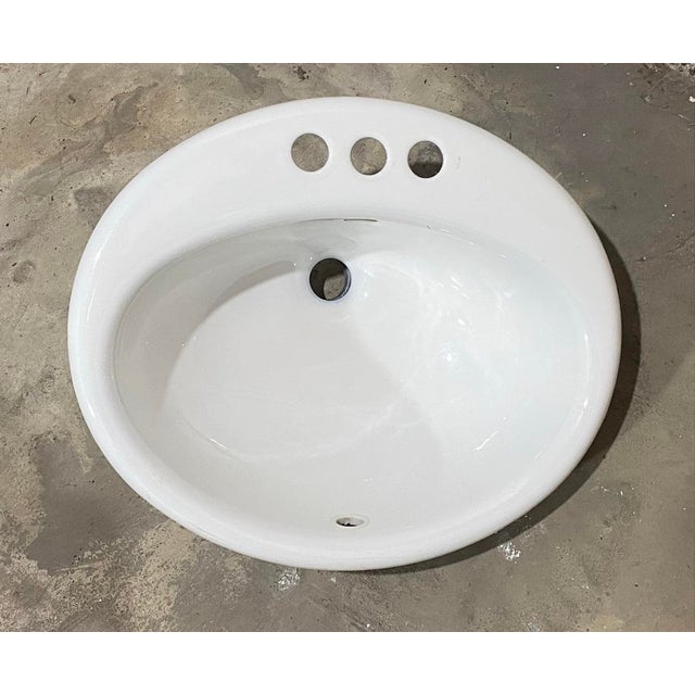 19” wide 16” tall Upgrade your vanity with this Classic Oval Drop-In Sink. Crafted from high-quality, non-porous ceramic,...