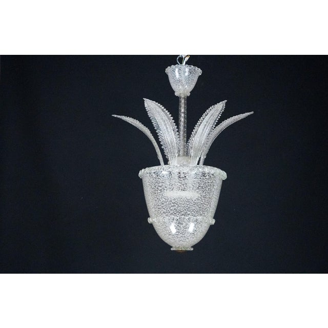 This exquisite chandelier is a vintage piece crafted in Murano, Italy, during the 1930s. It showcases traditional Venetian...