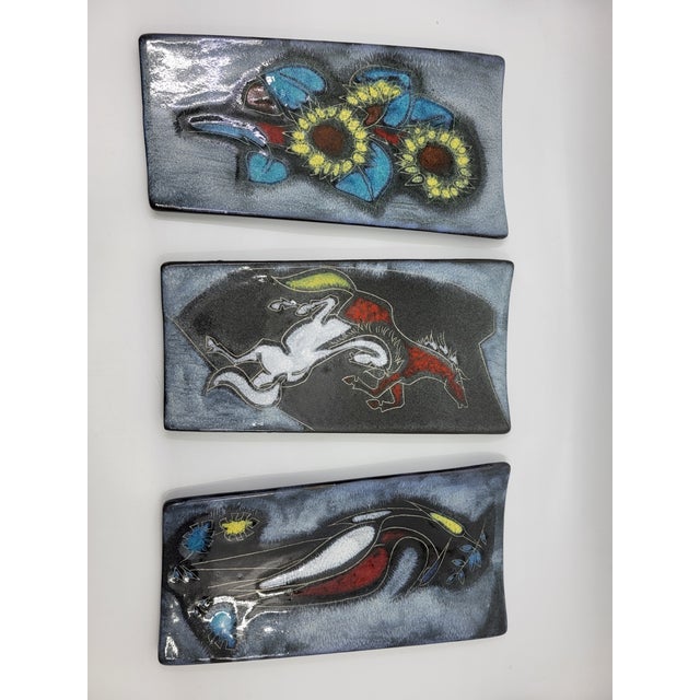 A true testament to modernist ceramic design and the fat lava/west german pottery era, this triptych captivates with its...
