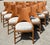 This exceptional set of ten dining chairs by luxury manufacturer Palecek embodies high-end coastal elegance and expert...