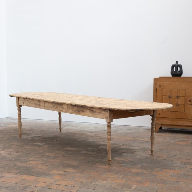 Large wooden communal table, early 20th century. Beech legs and fir top. Height under the apron: 59 cm. Water-repellent...