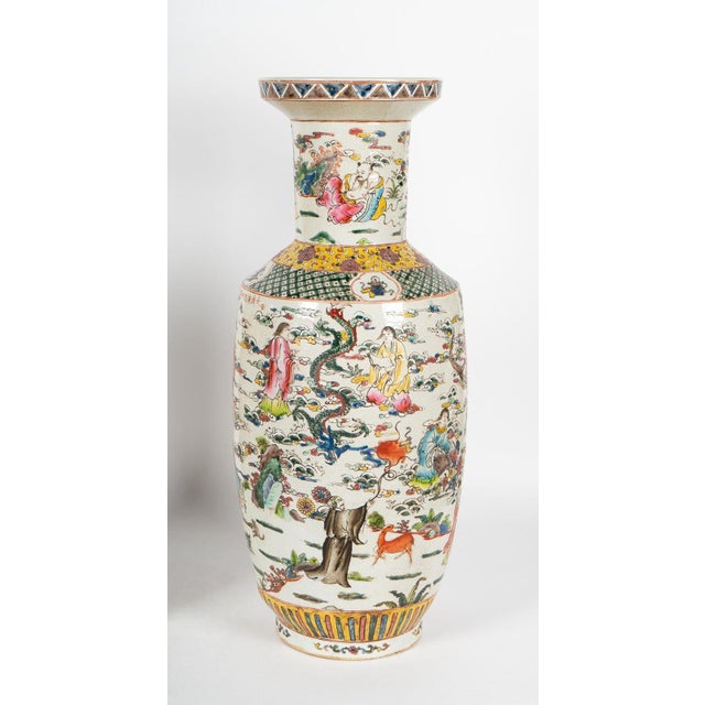 A pair of beautiful Famille Verte porcelain vases made in China in the 1900's, finely hand-painted all around with...