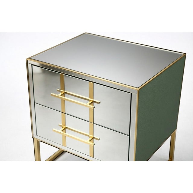 A pair of contemporary mirrored nightstands designed for high-end residential and hospitality interiors. Crafted with a...