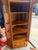 A beautiful and unusually compact antique Gold Oak corner china cabinet dating to approximately 1895-1910. Designed to fit...