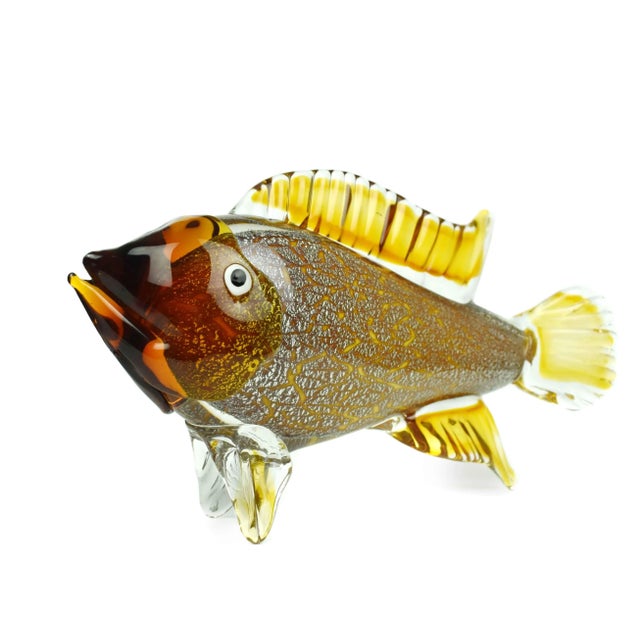 A whimsical Mid Century Modern large heavy Italian handblown art glass yellow/amber color fish with silver flakes...