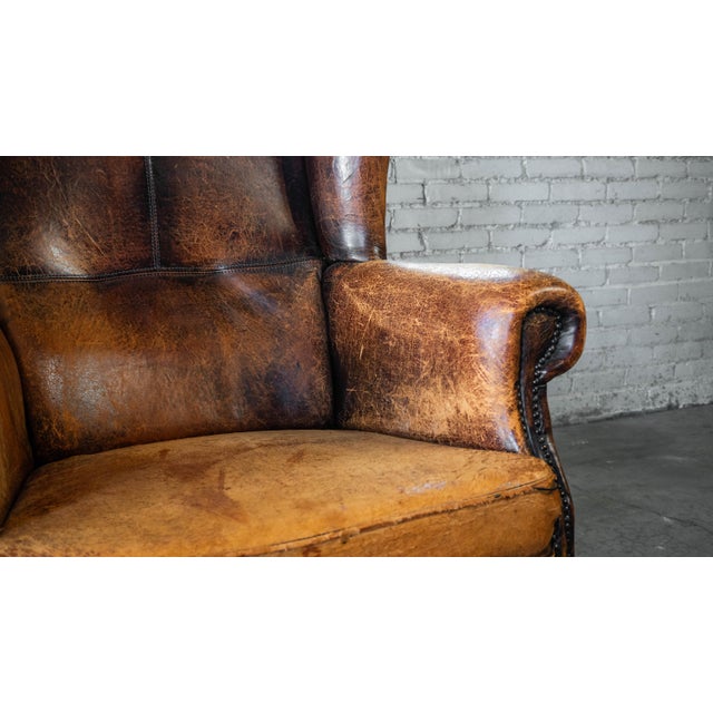 1970s Vintage Art Deco Distressed Cognac Leather Wingback Chair & Ottoman For Sale In Boston - Image 6 of 16