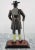 Metal Black Forest clock Staiger West Germany. Cast iron statuette of a cavalier with a walking stick in his hand and a...
