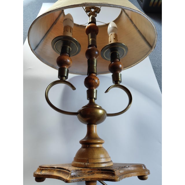 Italian designer table lamp. The lamp pictured is a Bouillotte table lamp in a classic vintage style. Brass and wooden...